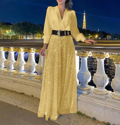 Elegantna bluza z dolgimi rokavi in V-izrezom ter široke hlače z bleščicami