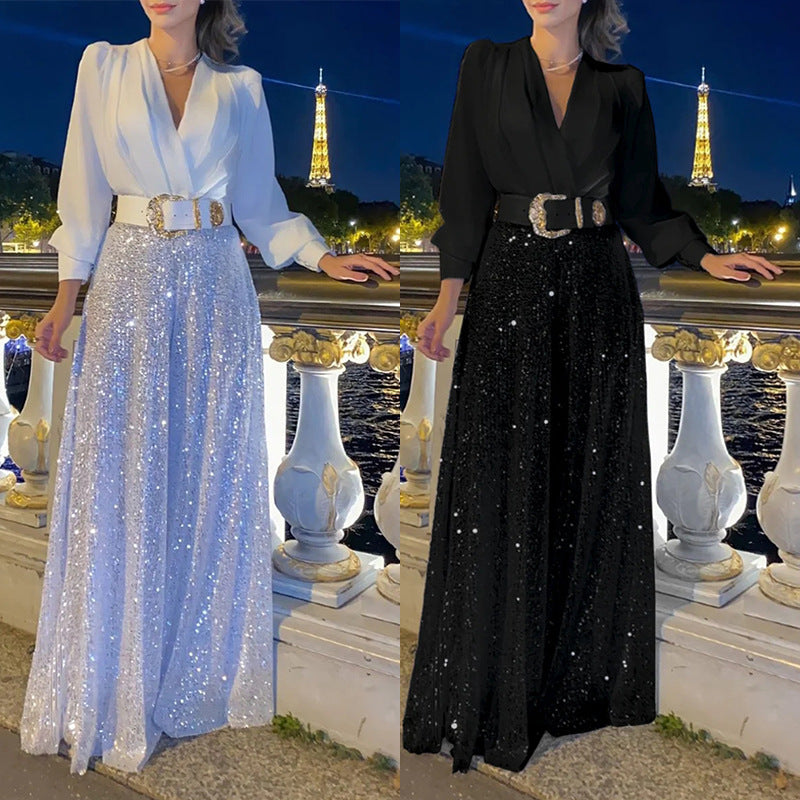 Elegantna bluza z dolgimi rokavi in V-izrezom ter široke hlače z bleščicami